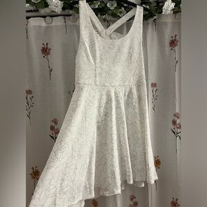 Flowy white and silver girls dress with bow detailing!